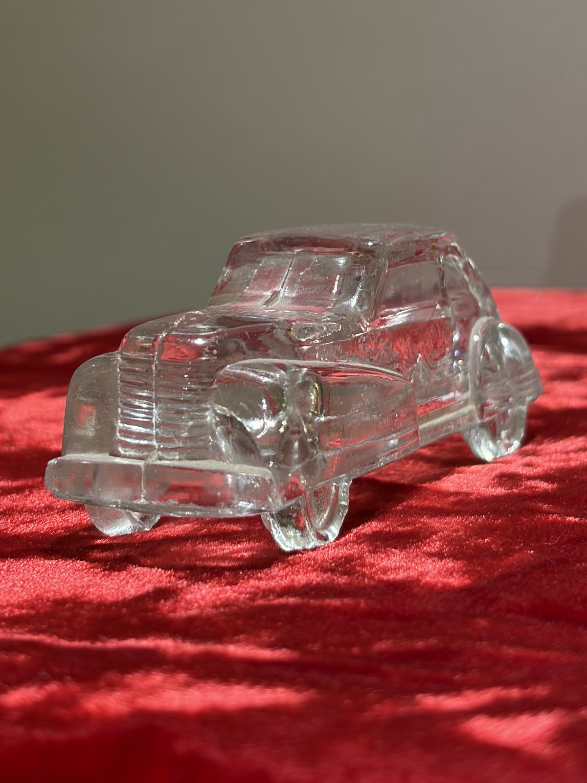 Pressed-glass model car, front three-quarter view