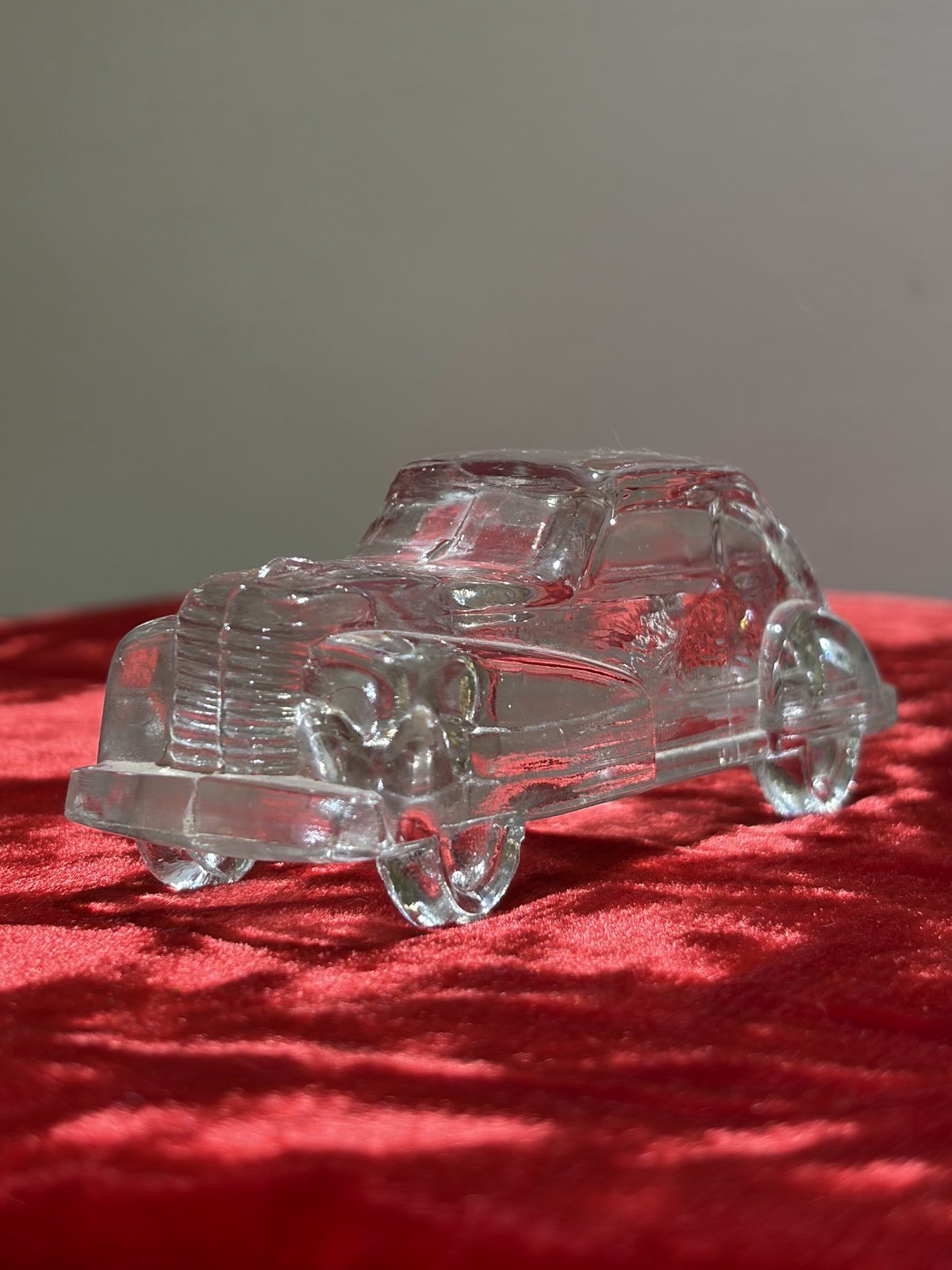 Pressed-glass model car, angled view